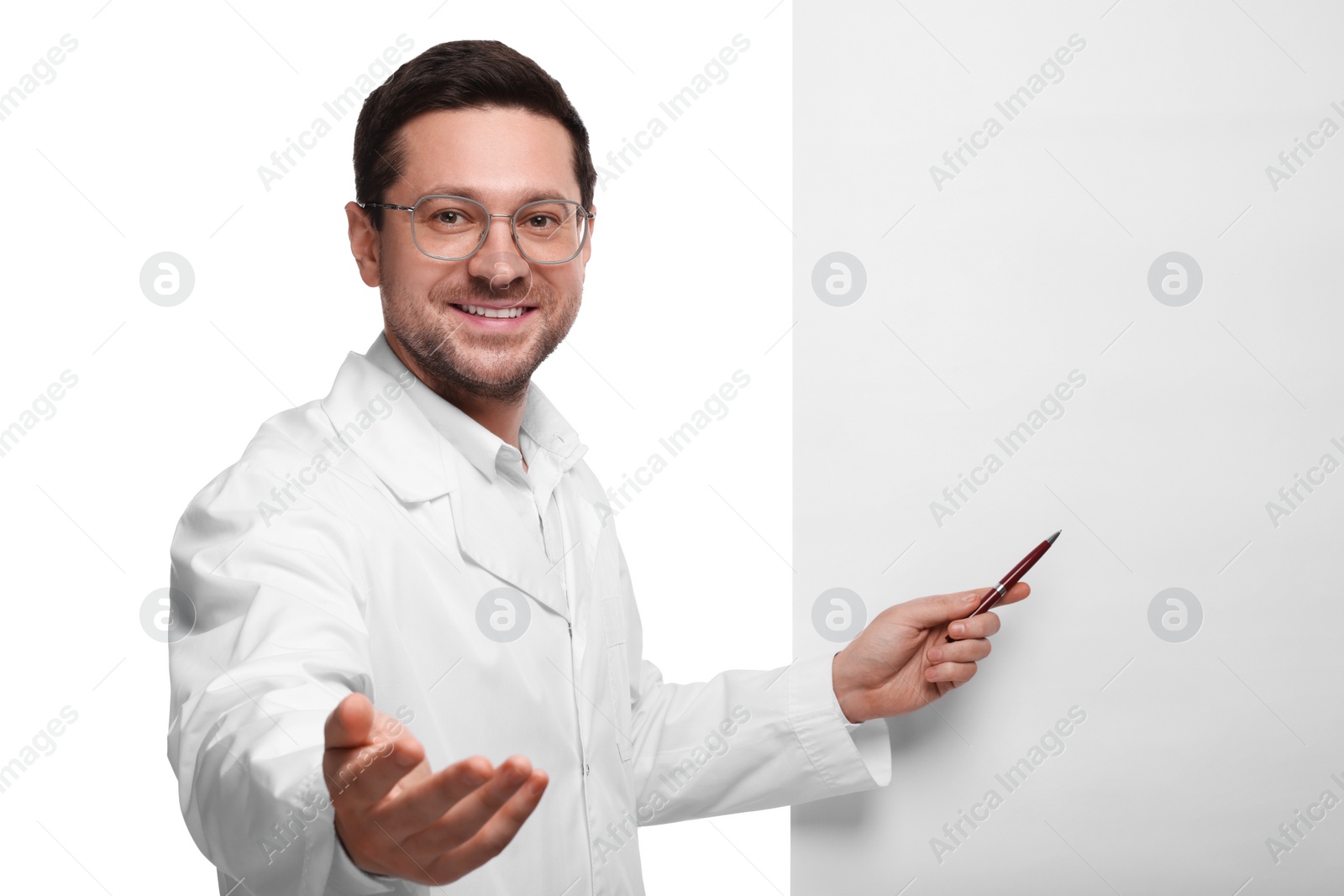 Photo of Ophthalmologist pointing at blank banner on white background, space for text