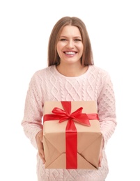 Happy young woman with Christmas gift on white background