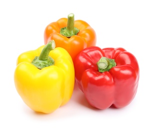 Fresh ripe bell peppers on white background