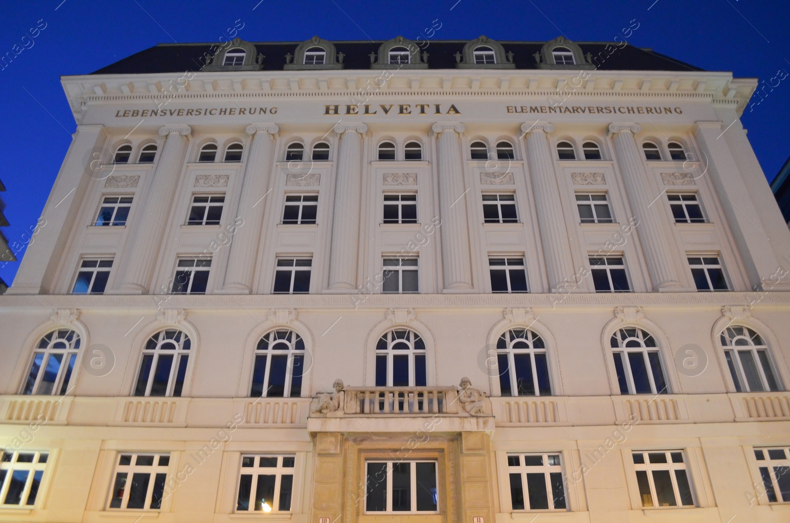 Photo of Vienna, Austria - June 20, 2018: Building of insurance company Helvetia in evening