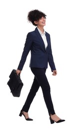 Photo of Beautiful businesswoman in suit with briefcase walking on white background