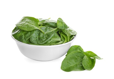 Fresh green healthy baby spinach leaves in ceramic bowl isolated on white