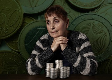 Image of Pension plan. Senior woman and money against coins on background