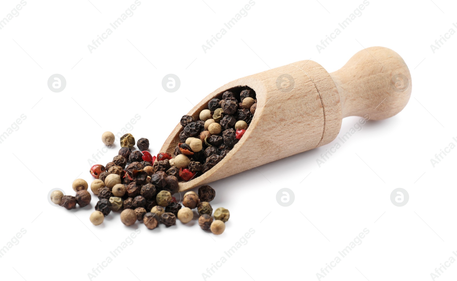 Photo of Aromatic spices. Different peppers and wooden scoop isolated on white