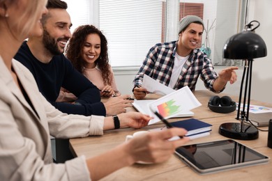 Photo of Team of employees working together in office. Startup project