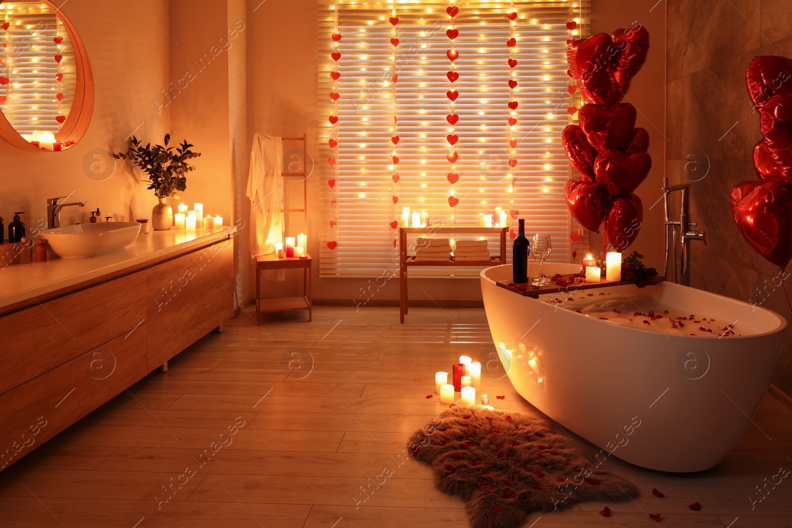 Photo of Stylish bathroom decorated for Valentine's day. Interior design