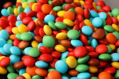 Photo of Many small colorful candies as background, closeup