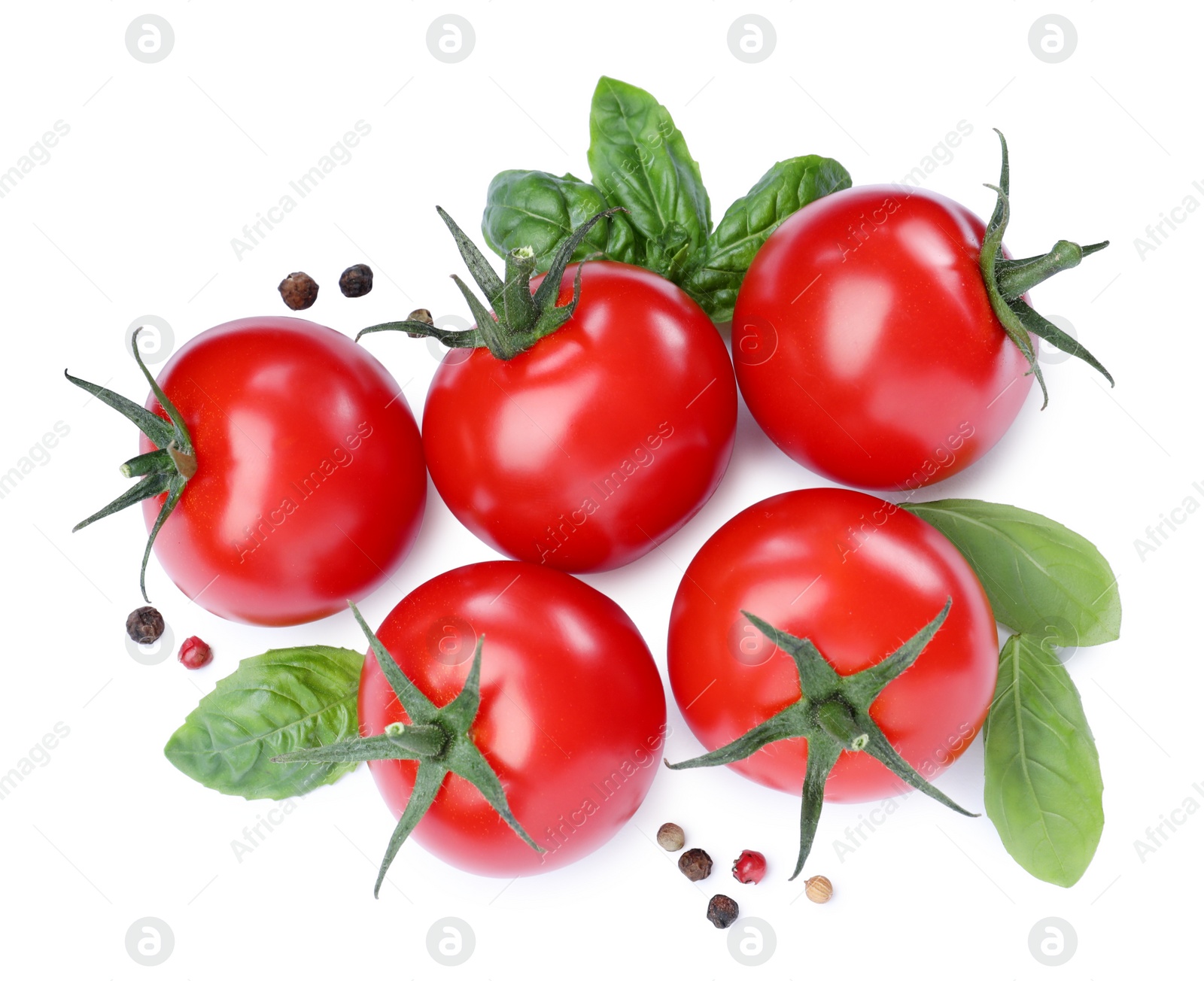 Photo of Fresh green basil leaves, spices and tomatoes on white background, top view