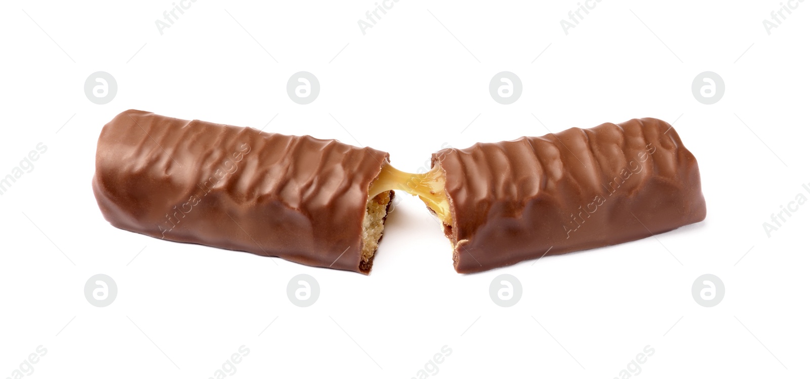 Photo of Pieces of chocolate bar with caramel on white background