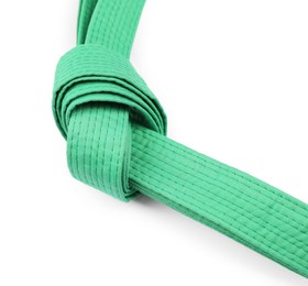 Photo of Green karate belt isolated on white. Martial arts uniform