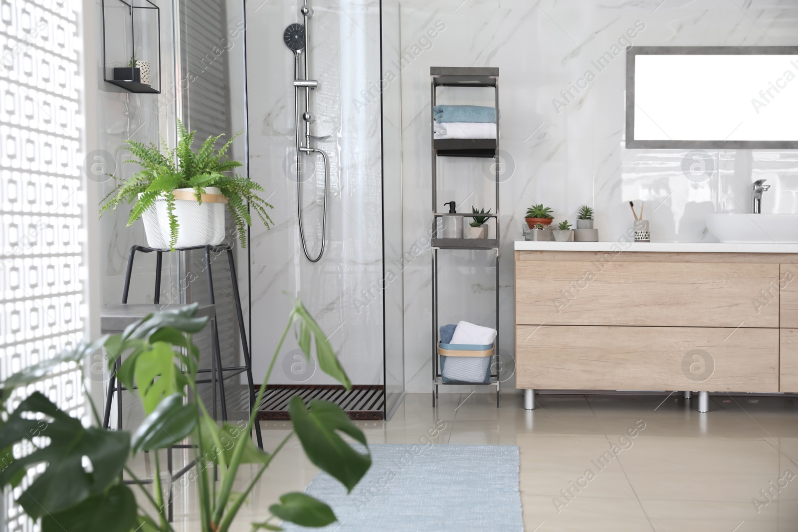 Photo of Bathroom interior with shower stall and counter. Idea for design