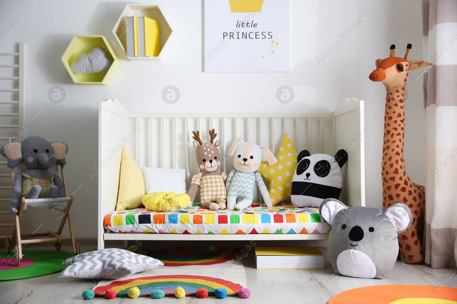 Photo of Baby room interior with stylish furniture and toys