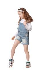 Photo of Cute little girl dancing on white background