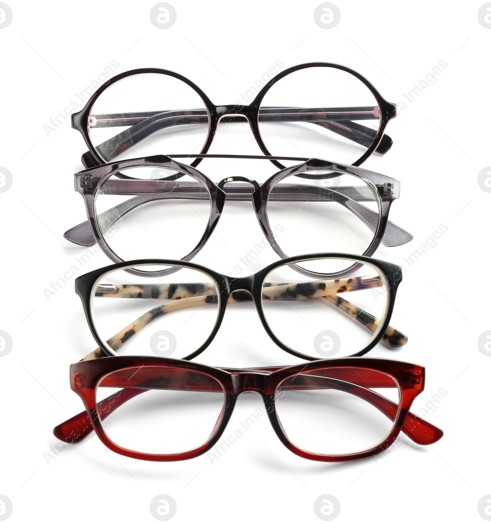 Different glasses with corrective lenses on white background. Vision problem Photo of Different glasses with corrective lenses on white background. Vision problem