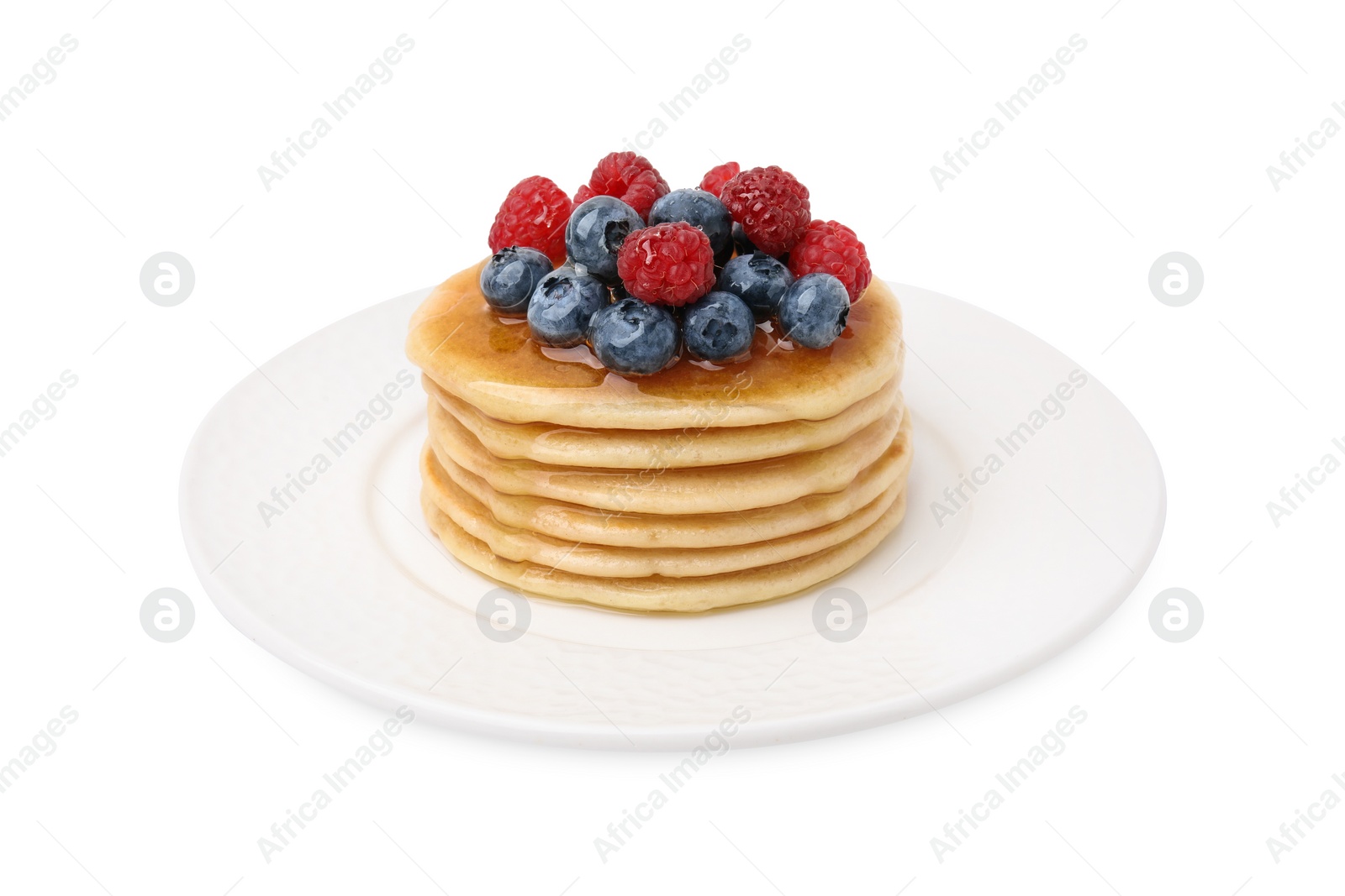 Photo of Delicious pancakes with berries and honey isolated on white