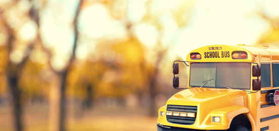 Image of Yellow school bus outdoors. Transport for students