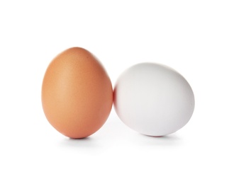 Photo of Few raw chicken eggs on white background