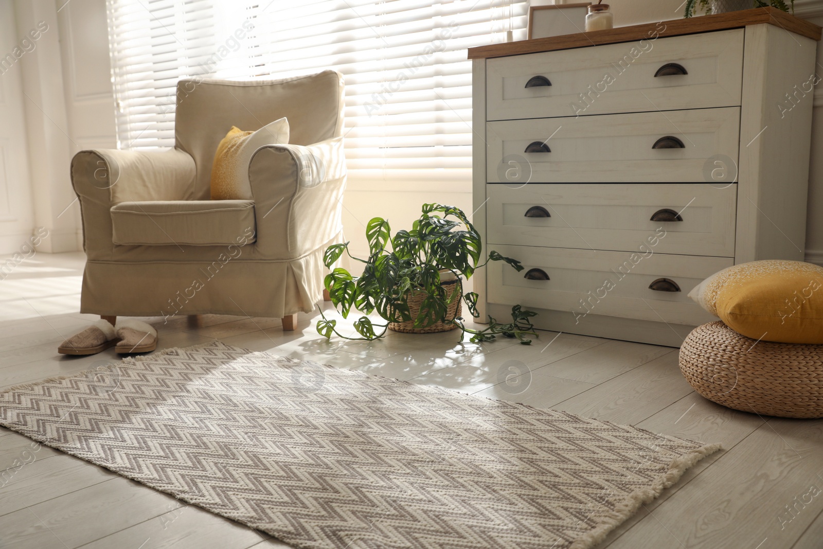 Photo of Modern room interior with stylish rug and furniture