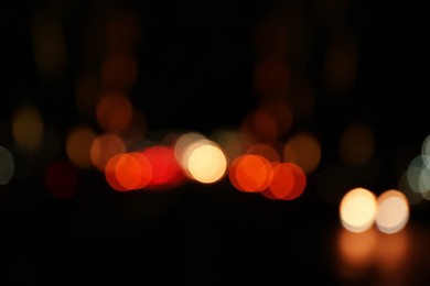 Photo of Blurred view of city lights at night. Bokeh effect