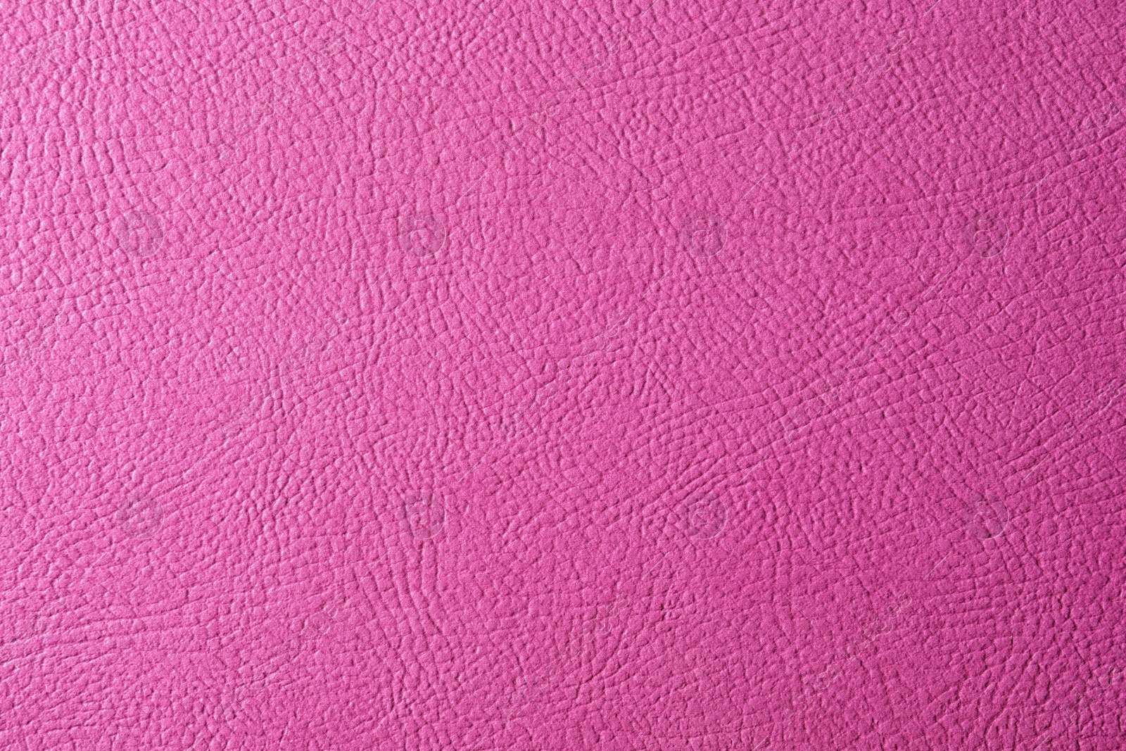 Photo of Texture of pink leather as background, closeup