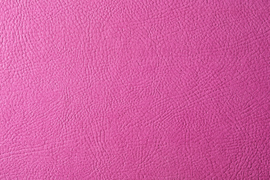 Texture of pink leather as background, closeup