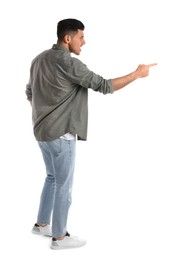 Photo of Emotional man pointing with index finger on white background