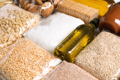 Photo of Many products on table, closeup. Food donation