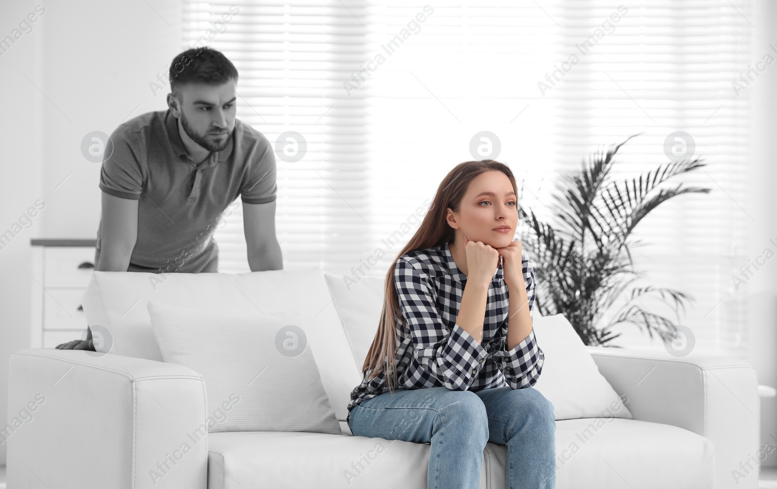 Image of Unhappy young couple with relationship problems at home. Cheating and breakup