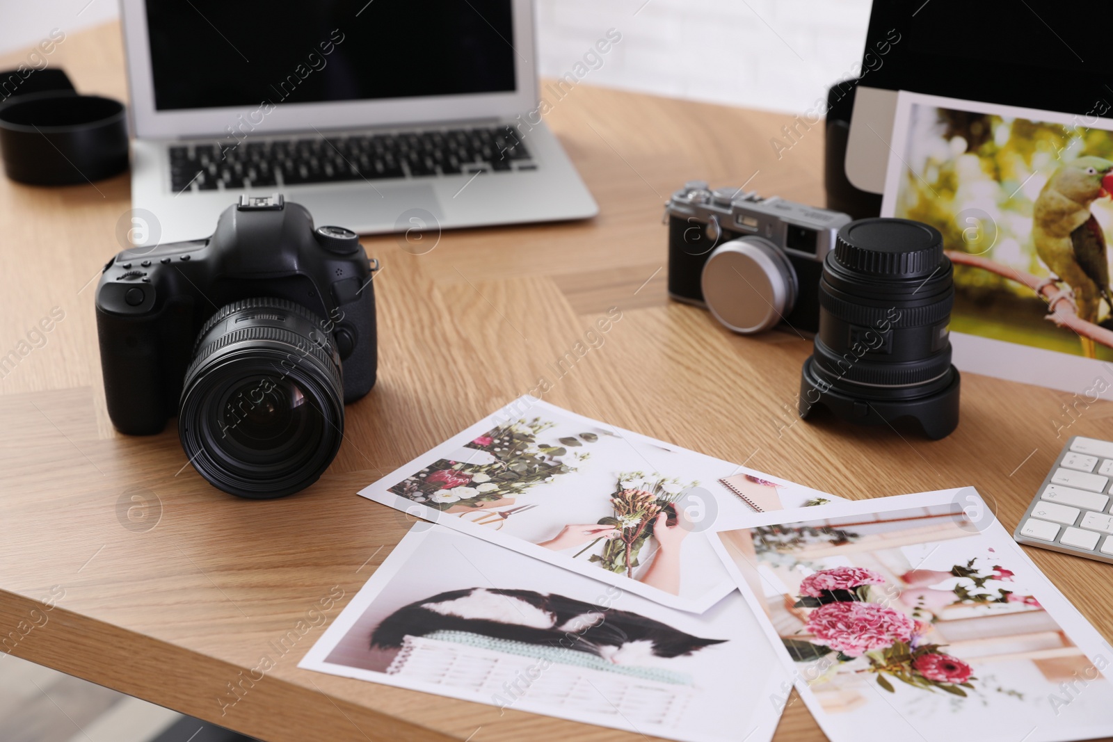 Photo of Photographer's workplace with professional camera in office