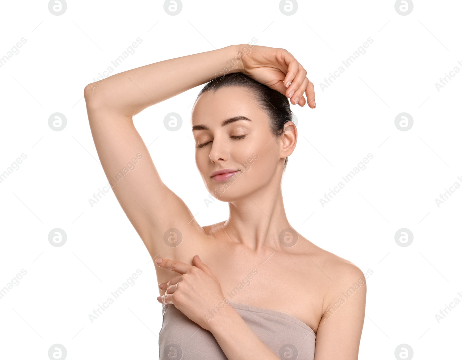 Photo of Beautiful woman showing armpit with smooth clean skin on white background