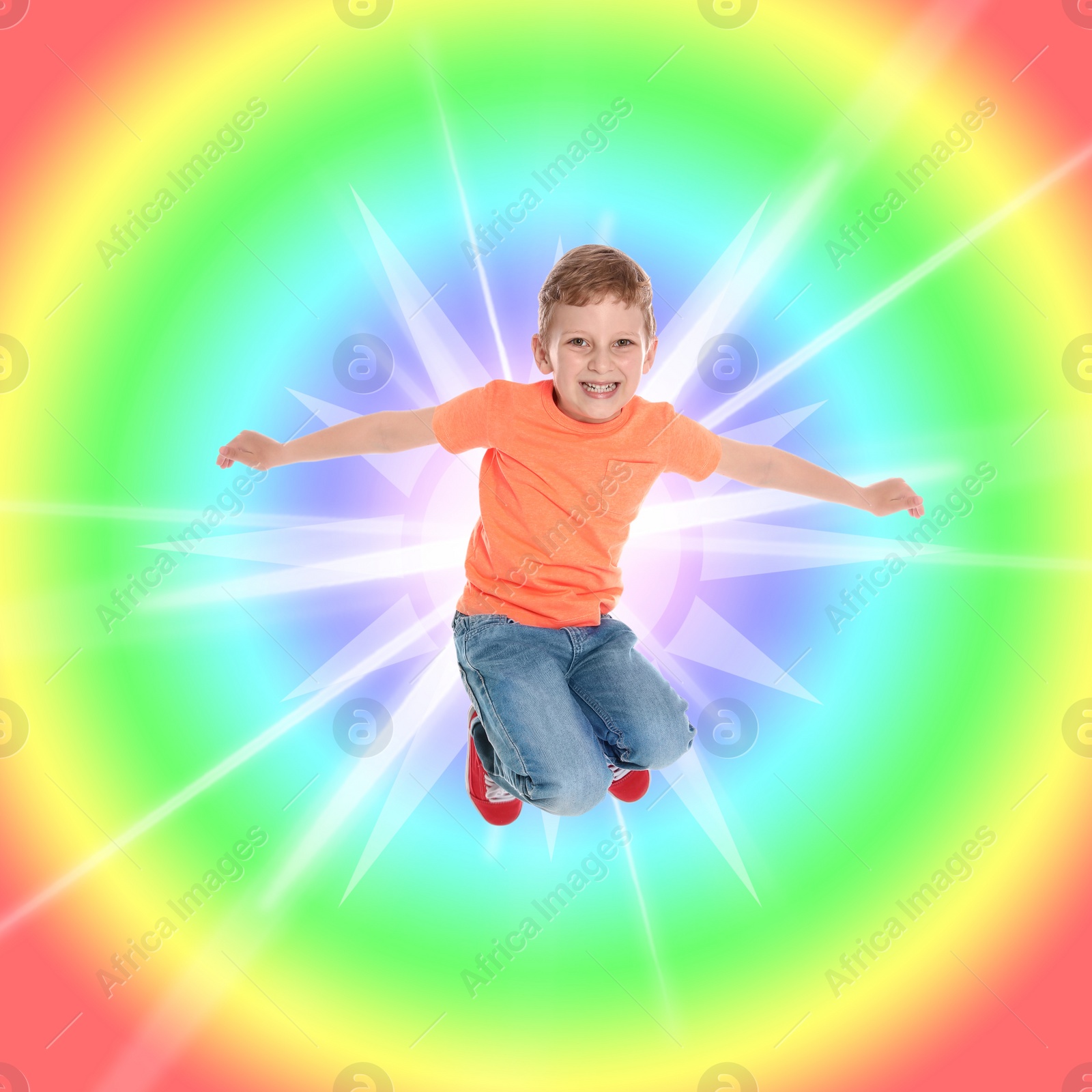 Image of Happy little boy jumping on colorful background. School holidays