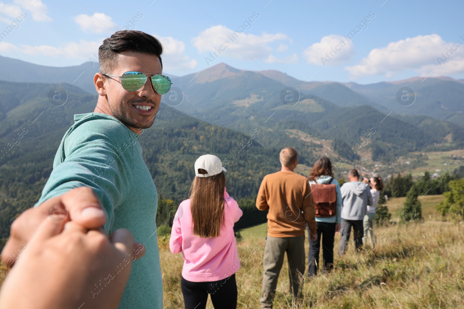 Photo of Group of people spending time together in mountains