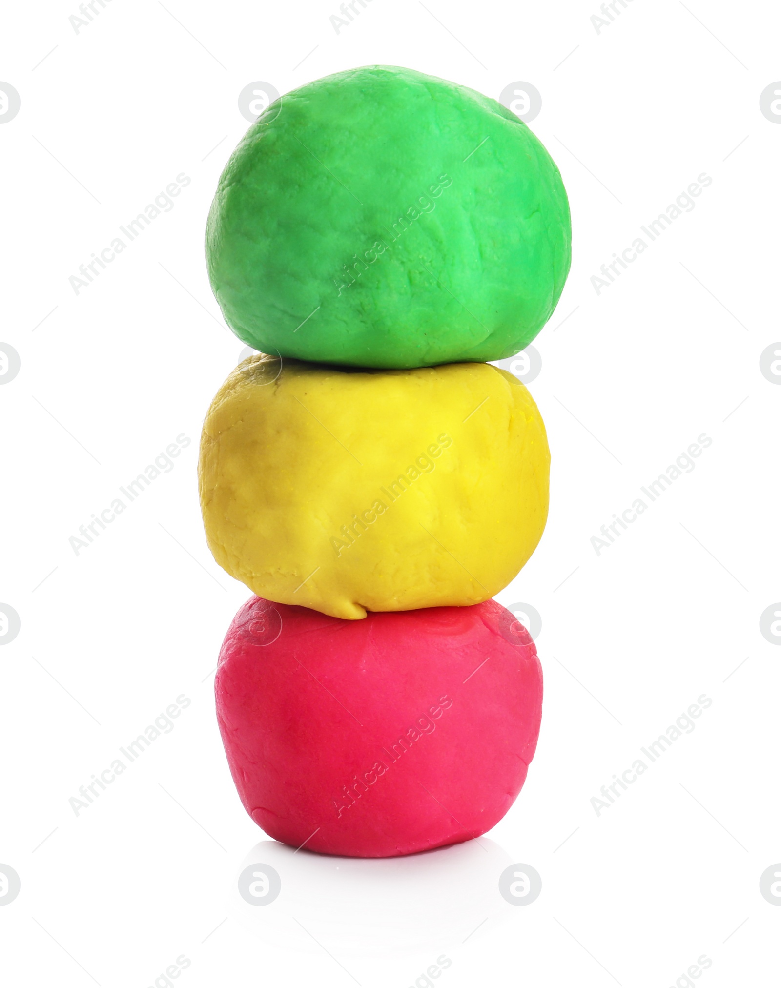 Photo of Colorful play dough on white background