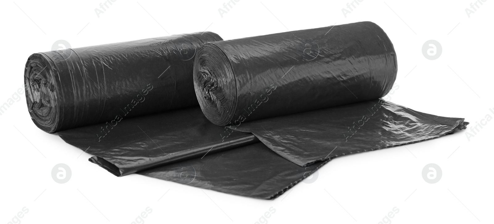 Photo of Rolls of black garbage bags isolated on white