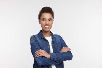 Portrait of beautiful young woman on white background