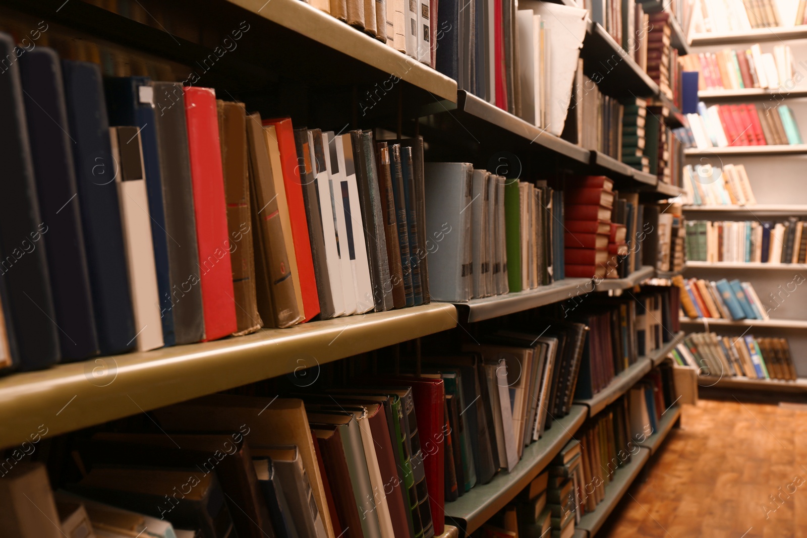 Image of Collection of different books on shelves in library