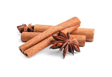 Photo of Aromatic cinnamon sticks and anise stars isolated on white