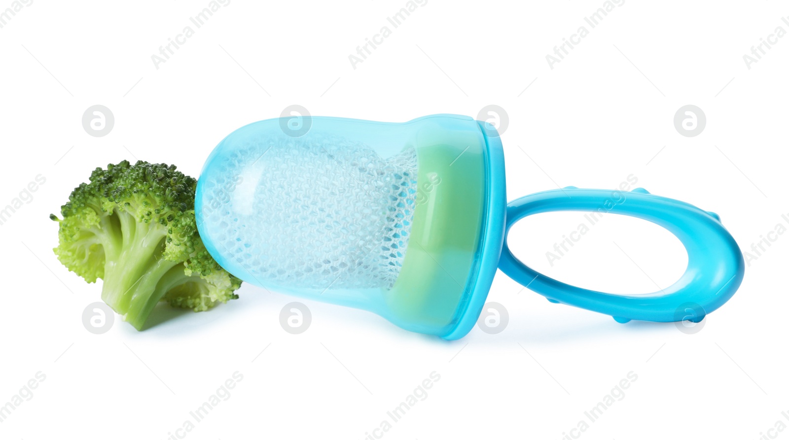 Photo of Empty nibbler and boiled broccoli on white background. Baby feeder