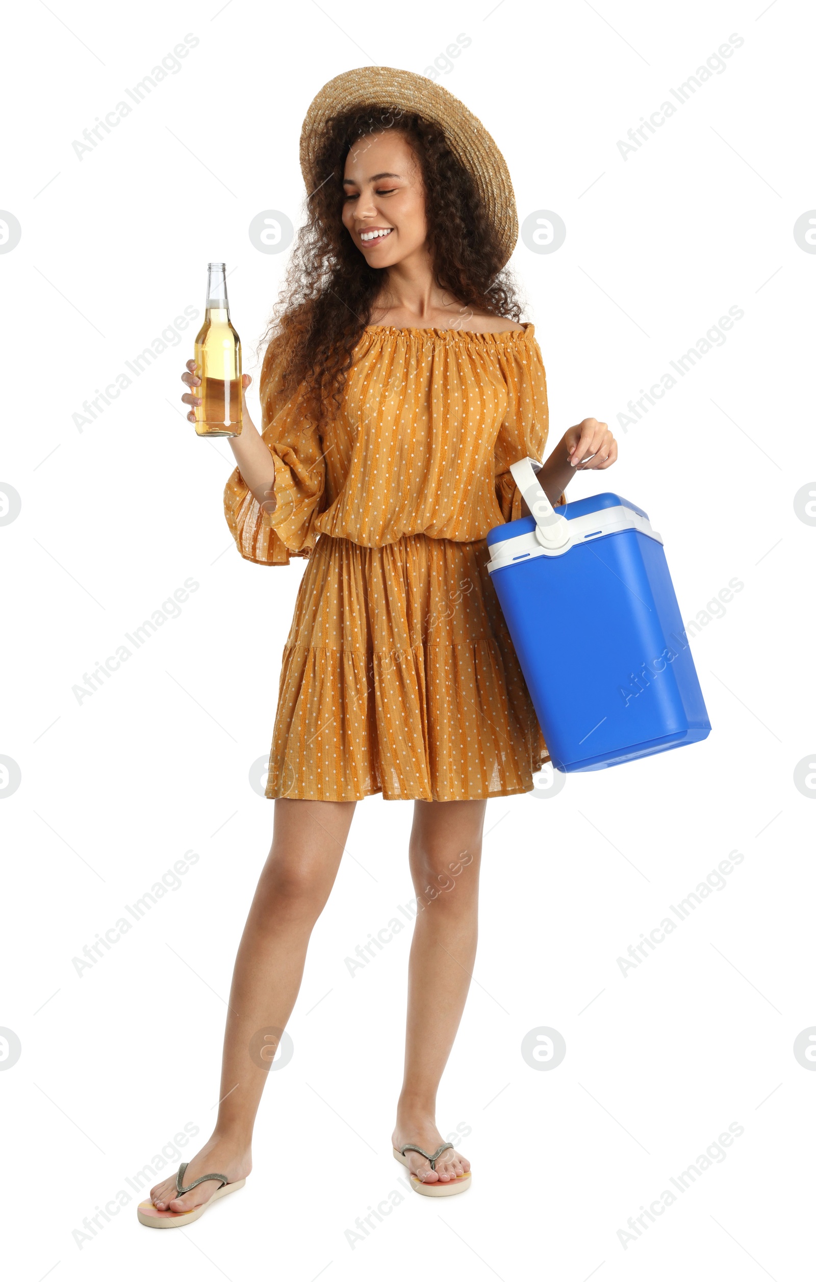 Photo of Happy young African American woman with cool box and bottle of beer on white background