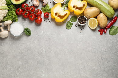 Flat lay composition with fresh products on light grey table,  space for text. Healthy cooking