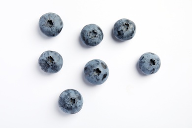 Flat lay composition with tasty blueberry on white background