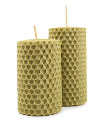 Photo of Stylish elegant beeswax candles isolated on white