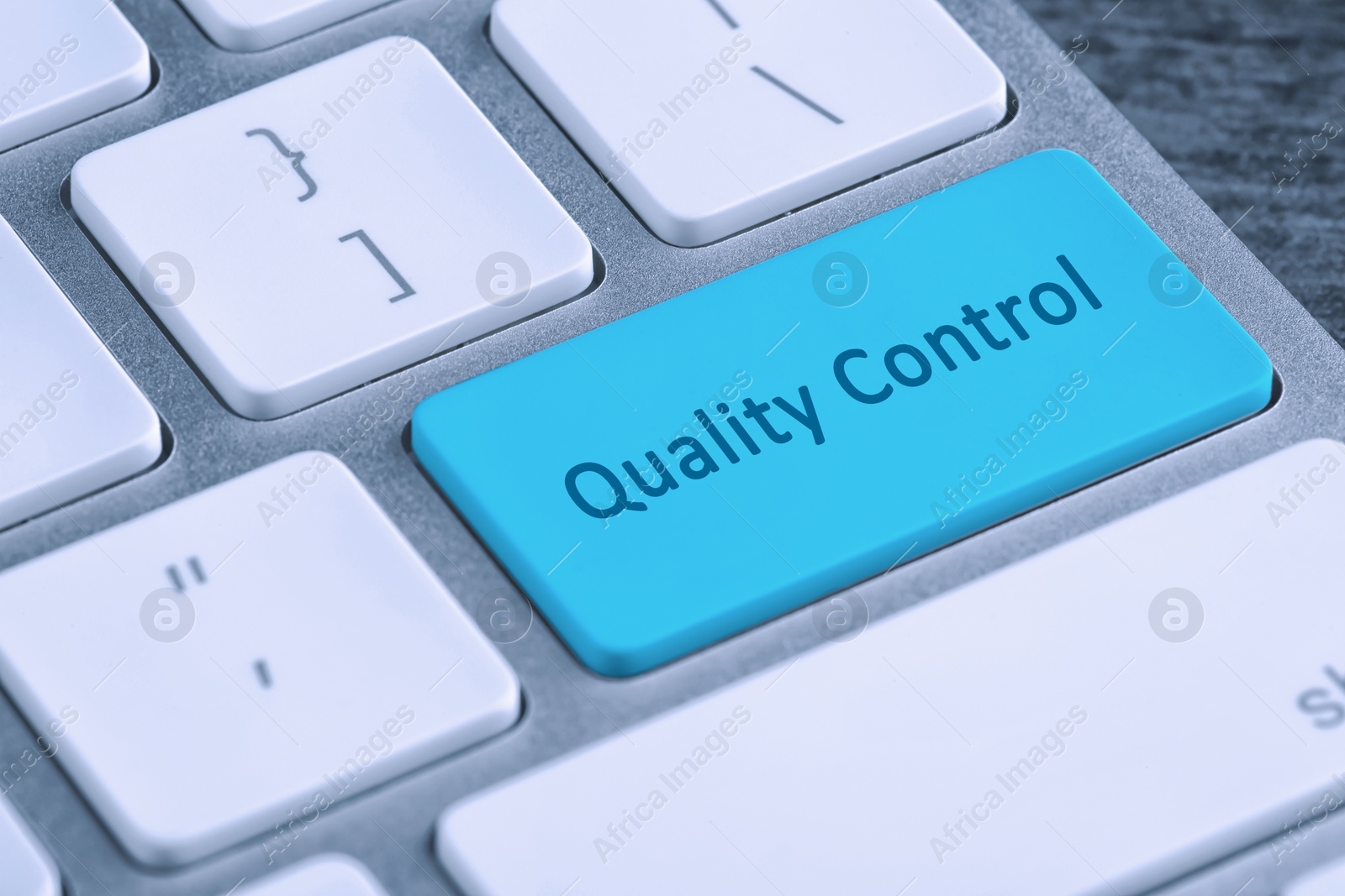 Image of Quality control button on modern computer keyboard, closeup