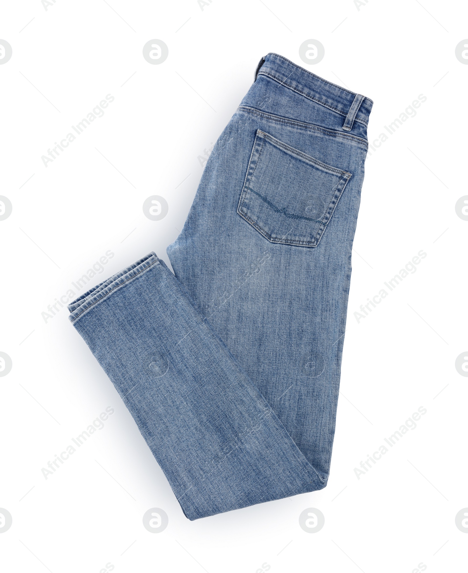 Photo of Stylish light blue jeans isolated on white, top view