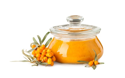 Photo of Delicious sea buckthorn jam in jar and fresh berries on white background