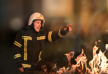 Image of Firefighter in uniform with helmet hurrying to rescue