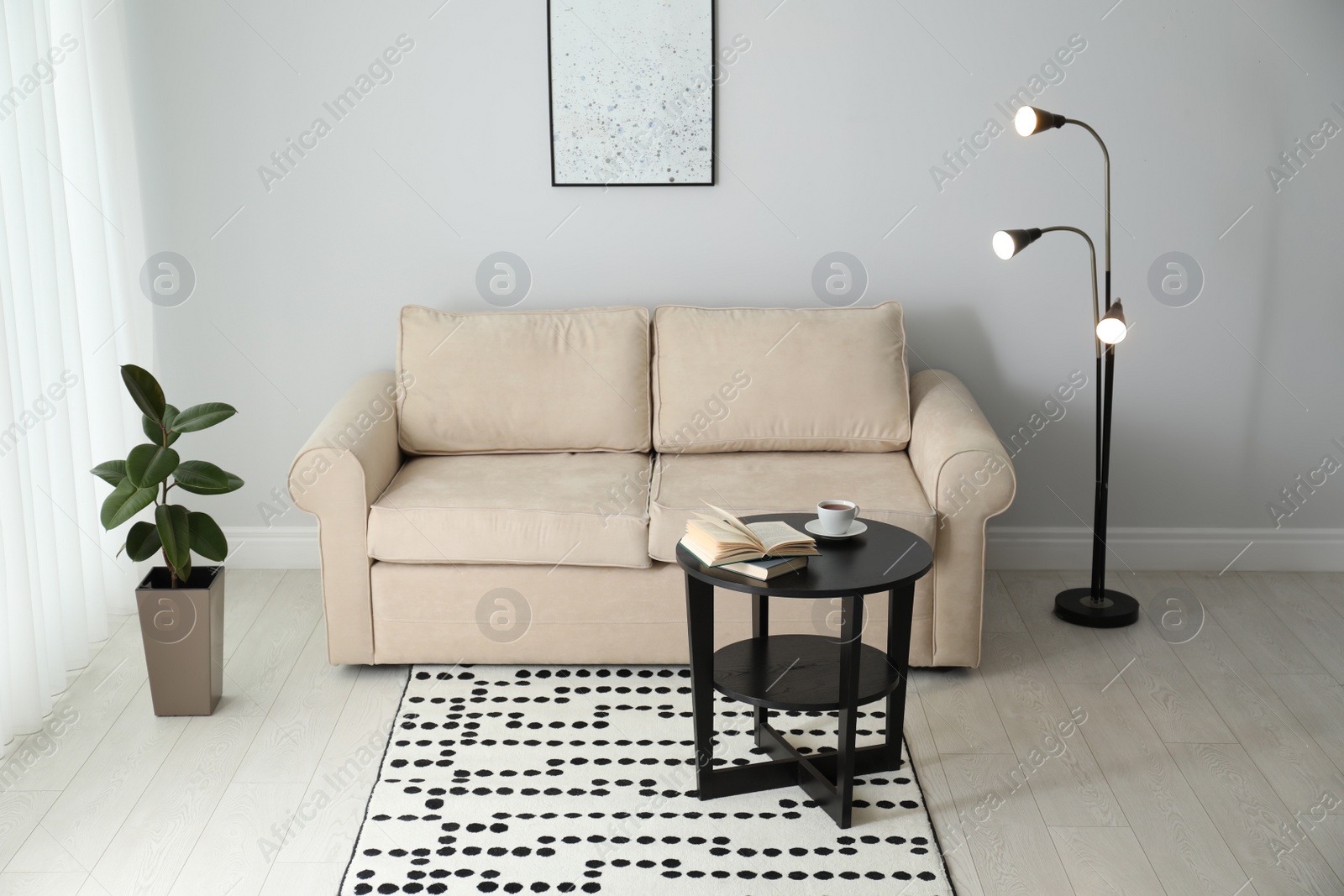 Photo of Modern comfortable sofa in stylish home interior