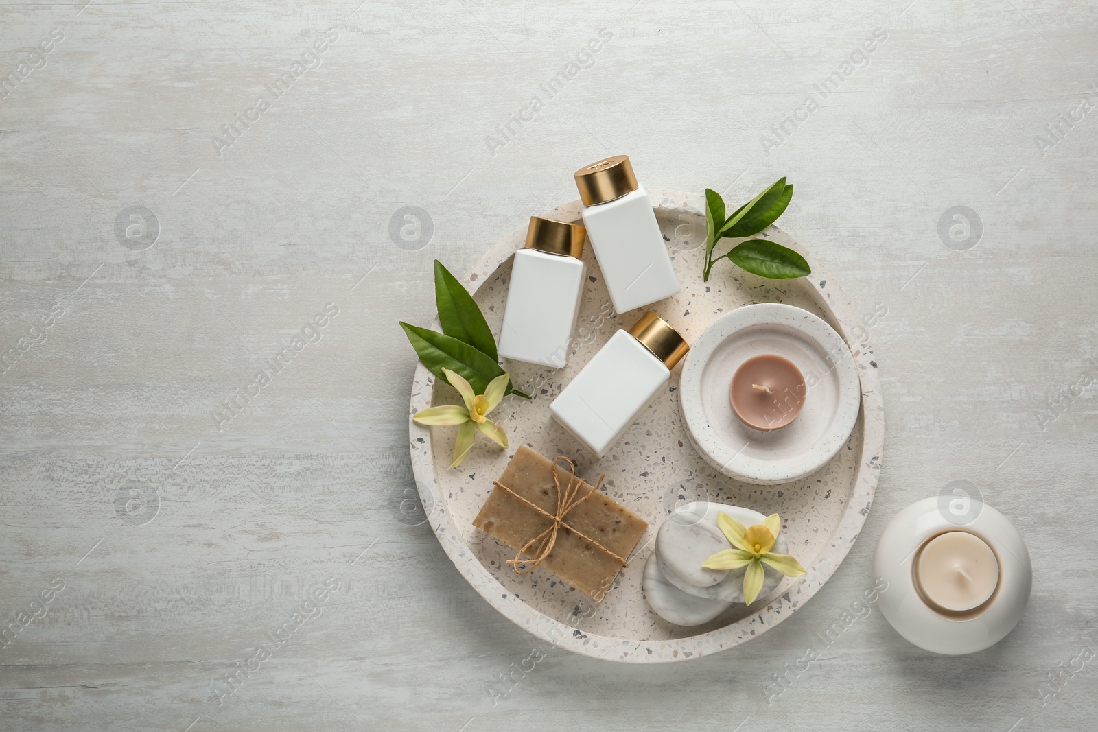 Photo of Flat lay composition with spa supplies on wooden table