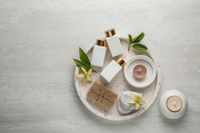 Photo of Flat lay composition with spa supplies on wooden table