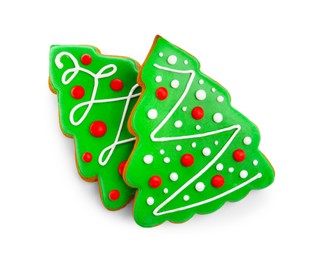 Photo of Tasty cookies in shape of Christmas trees isolated on white, top view